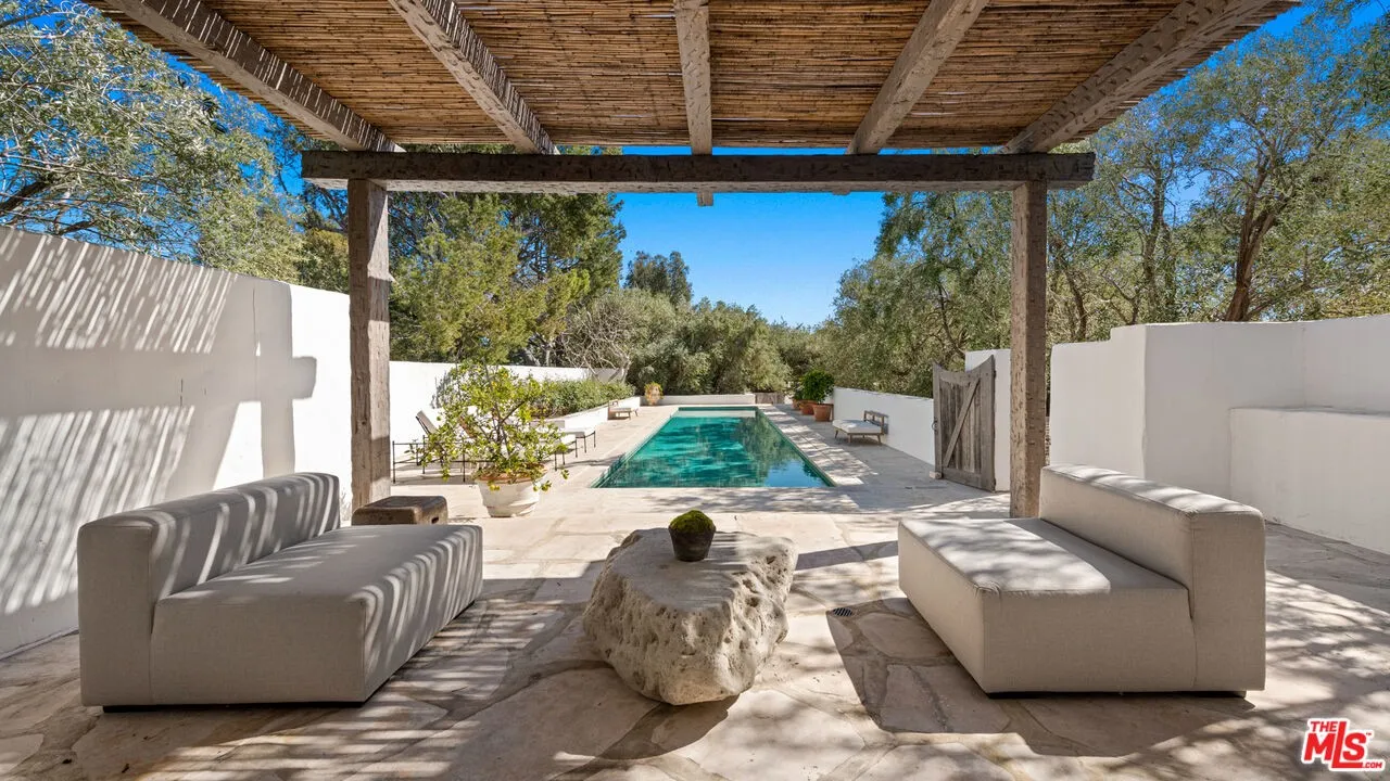 Shaded pool pavilion at the Malibu estate